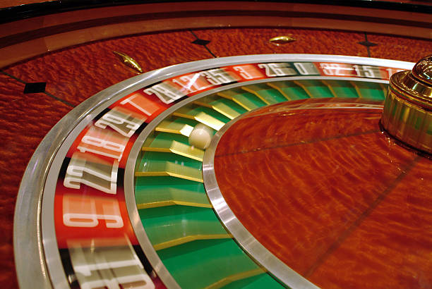 VIP Roulette wheel and high-stakes betting table on kingdomtoto link with dealer visible